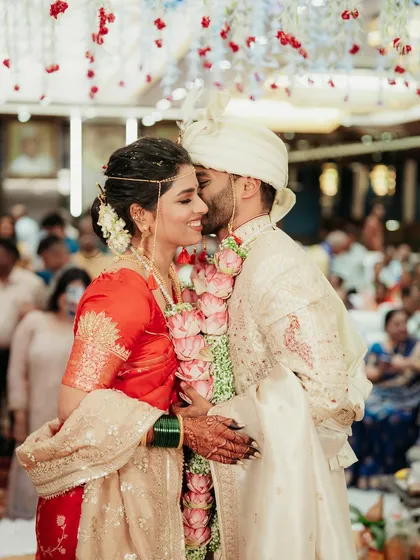 A sweet kiss on the cheek from the groom.