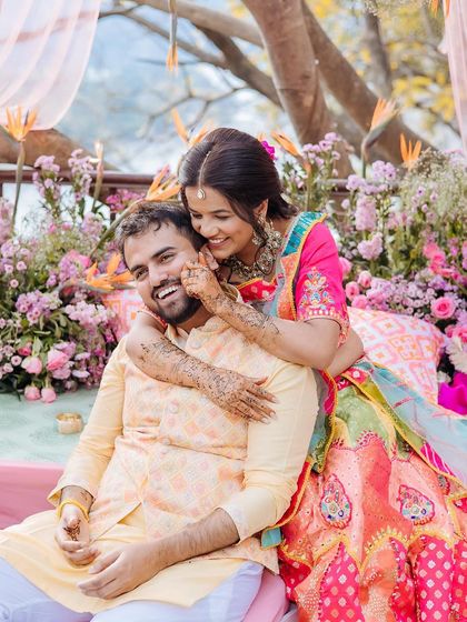 A repeat of image 416, a cute and playful moment of the bride hugging the groom from behind.