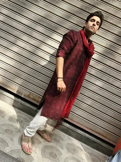 A full-length shot of my Diwali 2023 outfit. The maroon kurta paired with a red bandhani scarf creates a striking and festive look.