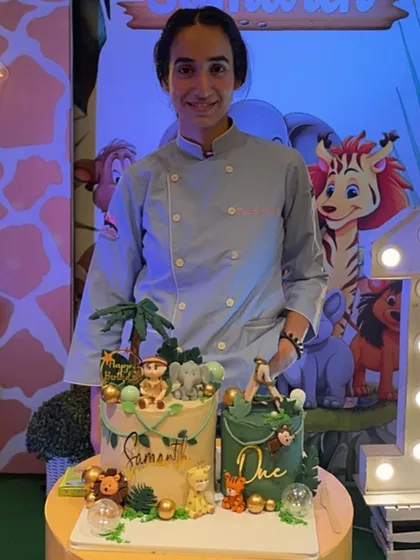 It's always so rewarding to see my cakes as the centerpiece of a celebration. Here I am with two jungle-themed cakes I made for a wild first birthday party.