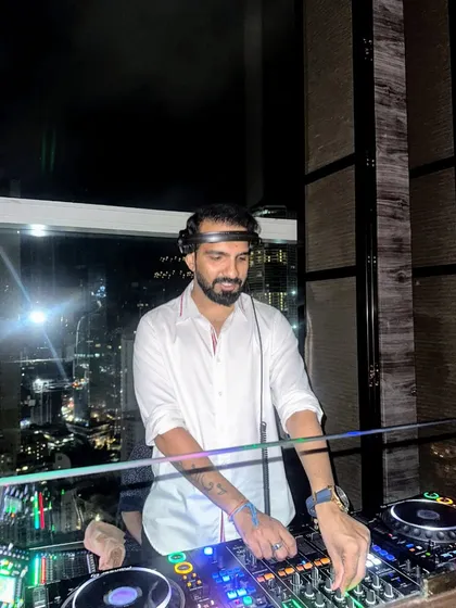 The beats were fire and the night was lit at Koishii. A shot of me against the backdrop of the Mumbai skyline.