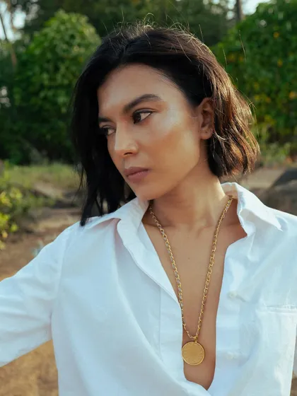 For this shot, I styled the model's hair in a short, wavy bob. The makeup remains natural and dewy, creating a fresh and modern look for the jewelry brand.