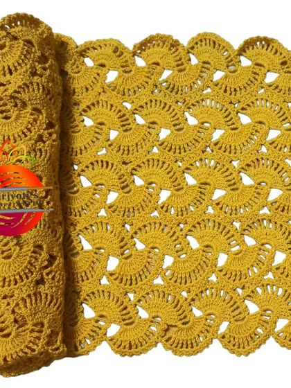 The lacy stole in a warm mustard yellow. This color is perfect for adding a pop of brightness to your outfit.