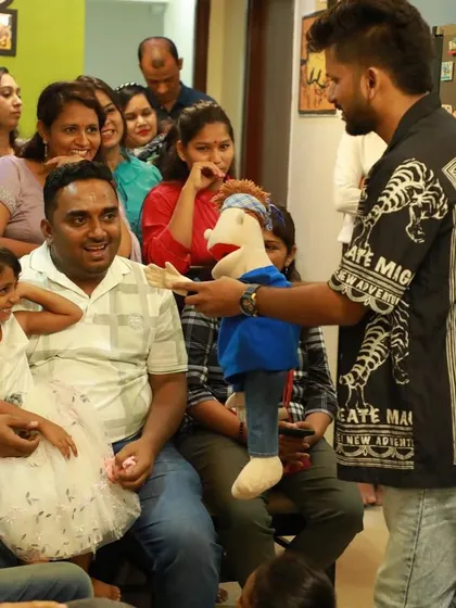 Interacting with an audience member and his daughter during a family show. Bunny loves meeting new people.