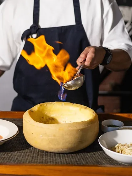 Savour the magic of fire and flavour. I bring the theatre right to your table, flambéing our Vodka Pasta live in a wheel of Parmesan for the ultimate creamy indulgence. It’s a dish that gathers a crowd and creates a memory.