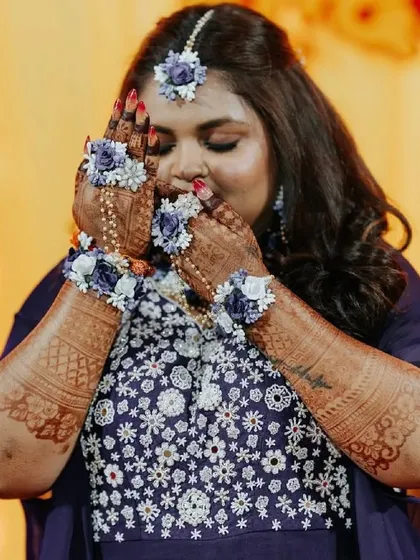 The fragrance and colour of fresh mehendi. This bride's happiness is as radiant as her henna stain.