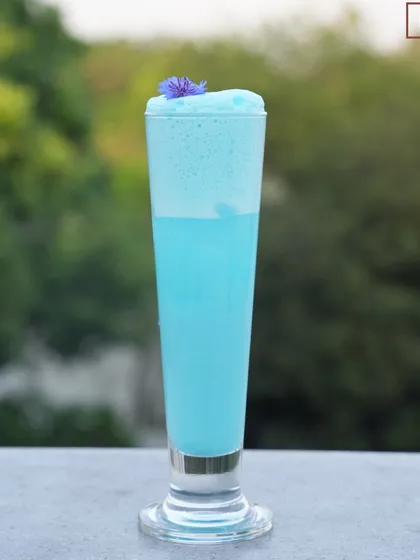 We cannot tell you what color happiness is, but it might just be blue. Our Blue Velvet cocktail is a visual delight, with its striking color and frothy top.