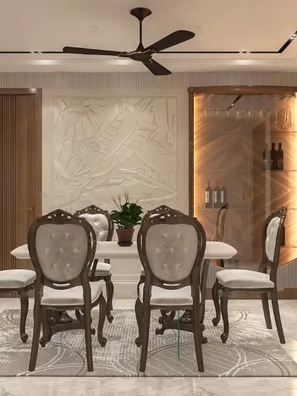 The dining area continues the home's earthy and elegant theme, featuring a classic wooden dining set and a view into the adjacent living spaces. A dedicated wine storage unit is visible.