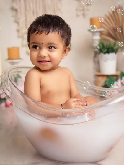 Splash time fun. After the cake smash, a warm bubble bath is a perfect way to get clean and capture even more adorable, happy photos.