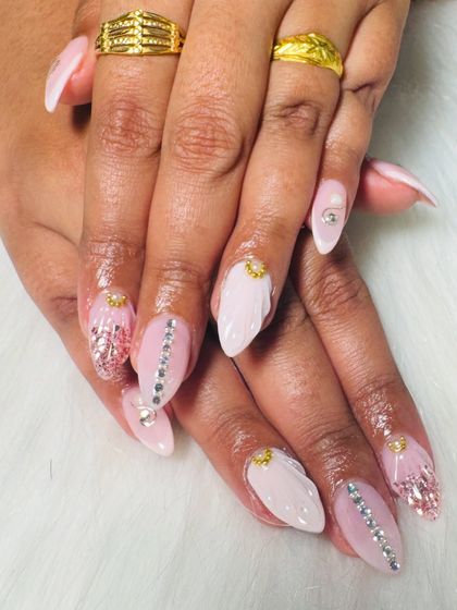 An angled shot highlighting the texture and sparkle of these custom bridal nails. Each nail is a small piece of art.