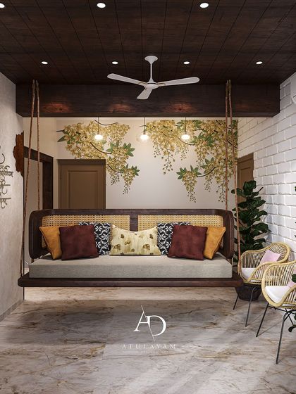 A relaxing swing area with a wooden swing bed, rattan backrest, and a beautiful wall inlay of Amaltas flowers.