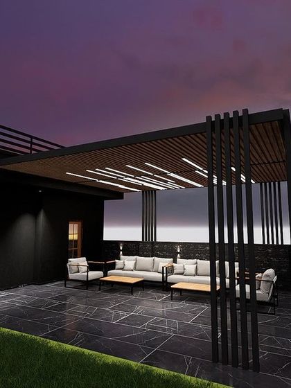 This terrace in Karol Bagh features a dramatic black pergola with integrated strip lighting. The dark marble flooring and minimalist furniture create a sleek, modern aesthetic perfect for evening entertaining.