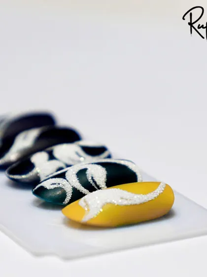 The sand/sugar technique used to create textured swirls.