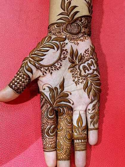 This design includes the initials 'AM' cleverly hidden within a floral pattern. We love personalizing our designs to make them more meaningful for you.