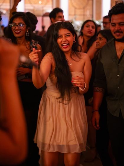 The pure energy of a New Year's celebration. A guest dances with joy, surrounded by friends, as we ring in the new year together.