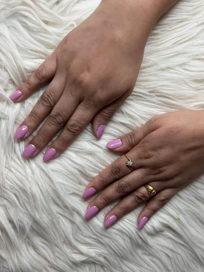 A different angle of the lavender gel polish nails, highlighting the clean application and elegant shape.