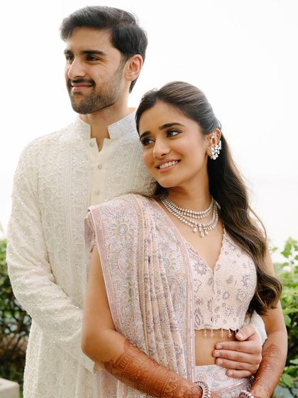 Another lovely shot of the couple. The bride's smile is radiant, and her natural-looking makeup enhances her joyful expression.