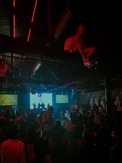 A wide shot of the club during my set, showing the crowd fully immersed in the experience.