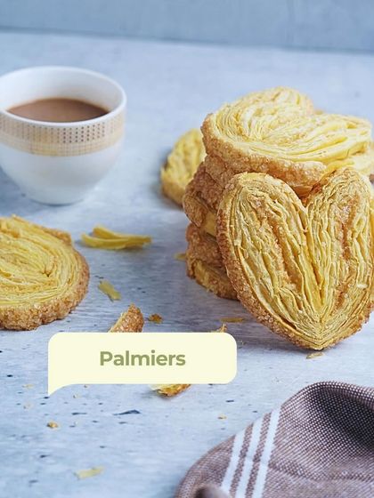 My heart-shaped Palmiers, stacked next to a cup of chai. These flaky, delicate biscuits have layers of buttery goodness, perfect for when you want something a little fancy.