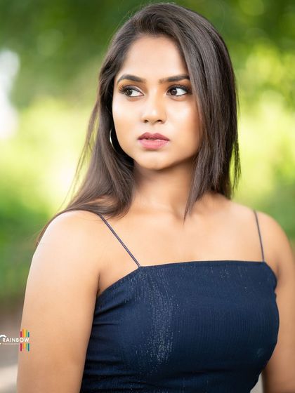A strong outdoor portrait. The model's direct gaze and the clean composition make this a powerful headshot for a portfolio.