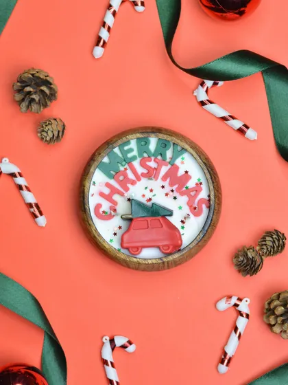 Make your holiday season merry with my 'Merry Christmas' candle. The festive red car carrying a Christmas tree is a classic and cheerful design.