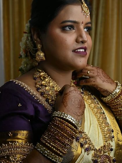 A profile view showing the complete styling. The way the jewellery sits, the neatness of the hair, and the glow of the skin all come together for a perfect bridal profile.