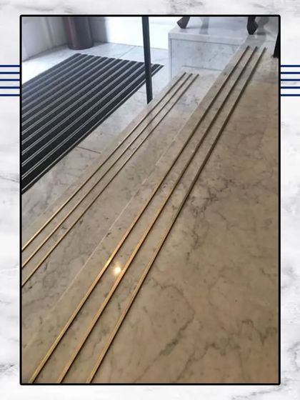 We use fine metal inlays in our marble flooring. These thin brass strips add a subtle touch of glamour and sophistication, catching the light beautifully.
