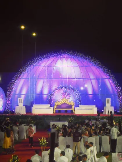 For a truly grand celebration, we can build massive, custom stage structures like this illuminated dome. This shows our capability in handling large-scale outdoor wedding receptions and sangeets.