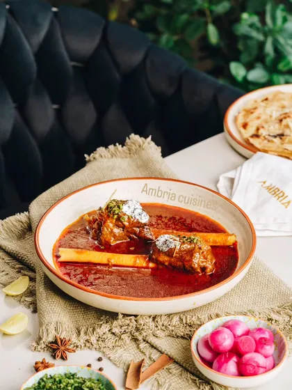 My Lamb Nalli Nihari, slow-cooked for hours to achieve a melt-in-your-mouth texture. Served with bone marrow, it's a true taste of Old Delhi's culinary heritage.