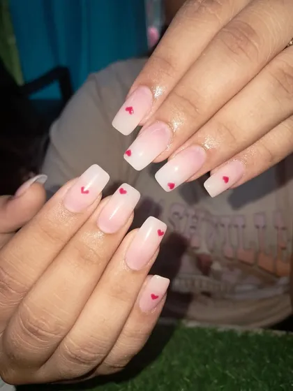 A simple and sweet design with tiny red hearts on a sheer, milky white base.