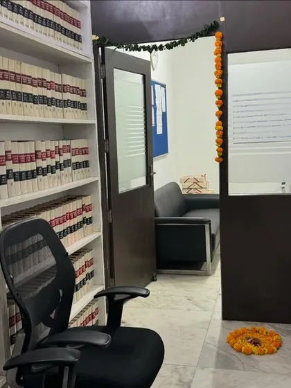My office library decorated for Diwali. The space is organized for efficiency, with extensive volumes of legal reporters and commentaries.