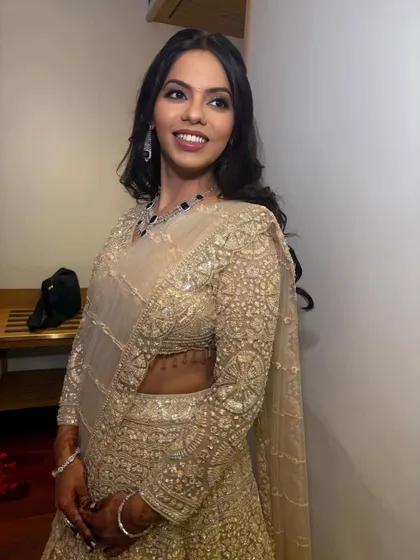 Another beautiful portrait of the bride, looking confident and glamorous. The soft curls and defined eyes complete her perfect engagement look.
