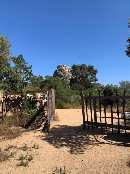 The entrance to our retreat location in Sardinia, Italy. The rustic gate opens onto a path that leads you away from the world and into a space of peace and spiritual practice.