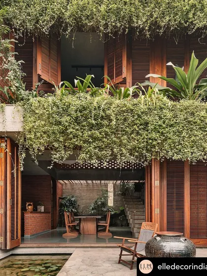 This view from the 'House of Memories' in Valsad captures my core belief in blurring the lines between indoors and outdoors. The cascading greenery creates a living curtain, making the garden an integral part of the home's architecture and daily life.