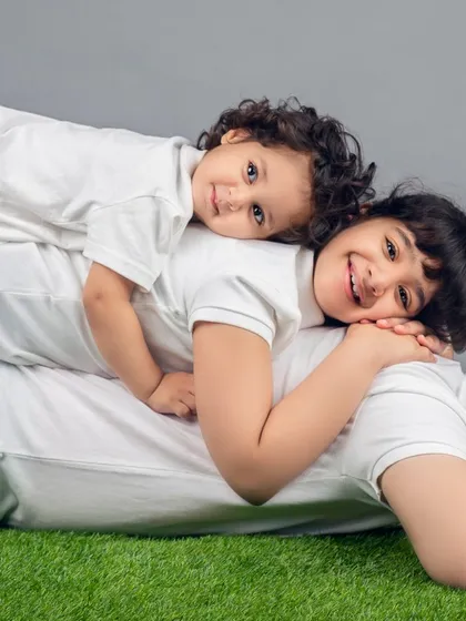 The sibling bond is so special. I arranged this fun "sibling stack" to capture the love and protective nature between these three, creating a family picture they will look back on and smile at for years.