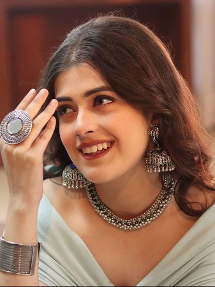 A close-up on the accessory styling for 'Haule Haule'. I selected a statement silver choker, large jhumkas, and a bold ring to complement the indo-western outfit and add to its bohemian charm.