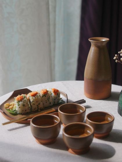 A beautifully arranged sake set from the 'Moments Together' collection, showcasing the versatility and thoughtful design of the student's work.