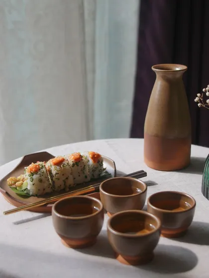 A beautifully arranged sake set from the 'Moments Together' collection, showcasing the versatility and thoughtful design of the student's work.