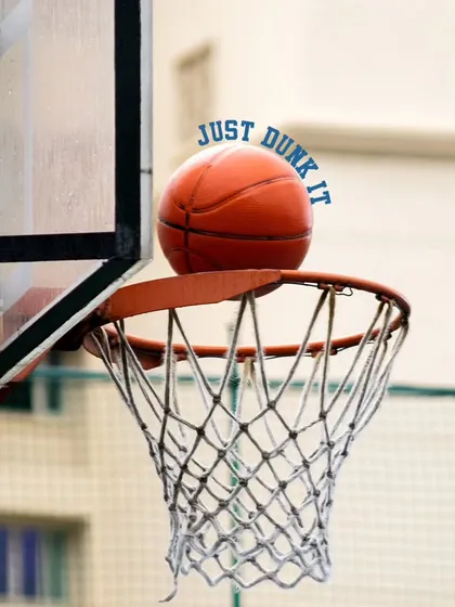 A "just dunk it" moment as the ball rests on the rim. It captures the split-second of anticipation before the score, a familiar feeling on our court.