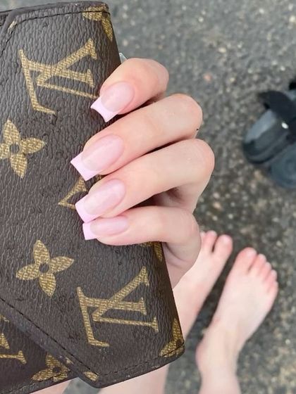A simple and clean look with a soft pink French tip on a square-shaped nail. This style is perfect for everyday elegance.