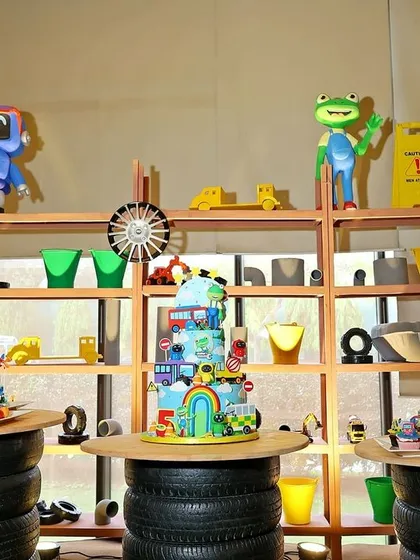 The dessert station was designed to look like a workshop shelf, with the cake and treats displayed on tables made from stacked tires.