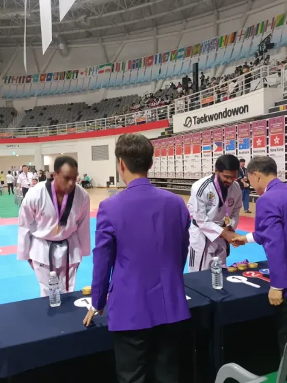 Bowing respectfully while receiving an award at the expo.