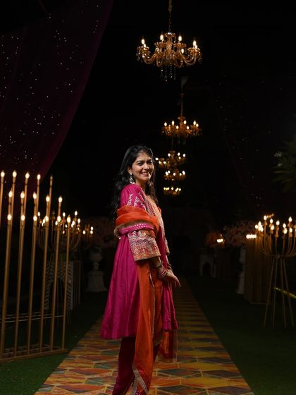 A full shot of the Mehendi outfit, showcasing the beautiful setting and the flow of the suit. I help you visualize how your outfit will look in the actual event space.