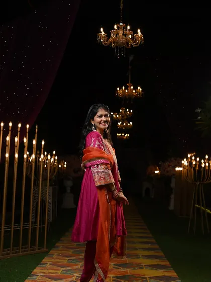 A full shot of the Mehendi outfit, showcasing the beautiful setting and the flow of the suit. I help you visualize how your outfit will look in the actual event space.