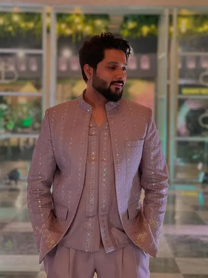 A closer shot of the elegant lavender suit. The subtle mirror work adds a touch of sparkle.