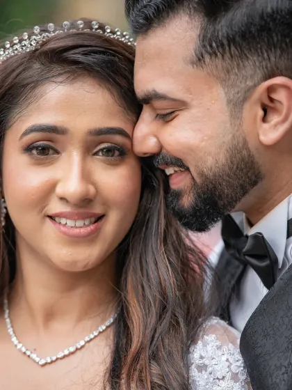 A beautiful close-up shot that captures the intimacy and happiness between the couple. His whisper and her smile make this a perfect candid portrait.