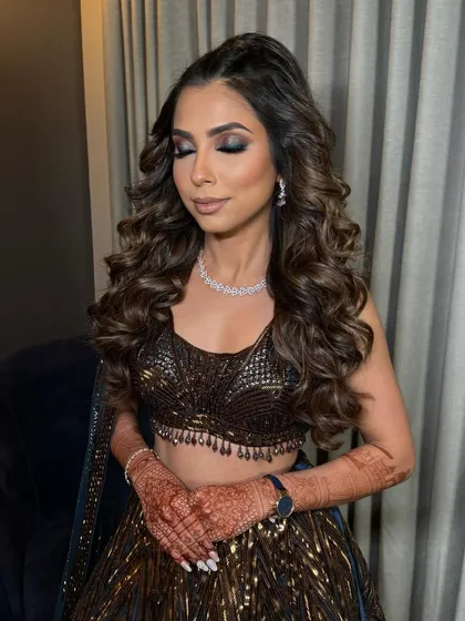 Another shot of the braided half-pony with full curls, a true statement style.