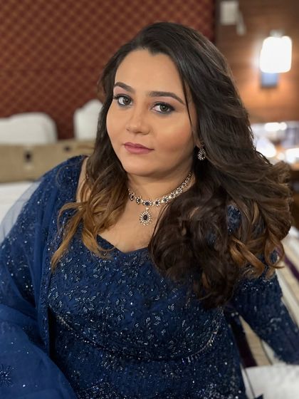The beautiful Anisha ready for her event. I created a natural and subtle makeup look with soft waves in her hair to complement her navy blue outfit.