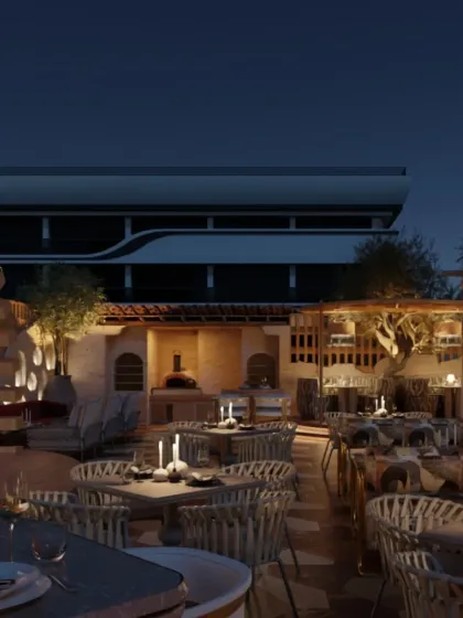 The rooftop features a wood-fired oven and candlelit tables, creating a warm and inviting atmosphere for evening gatherings. The design is a perfect blend of rustic charm and urban sophistication.