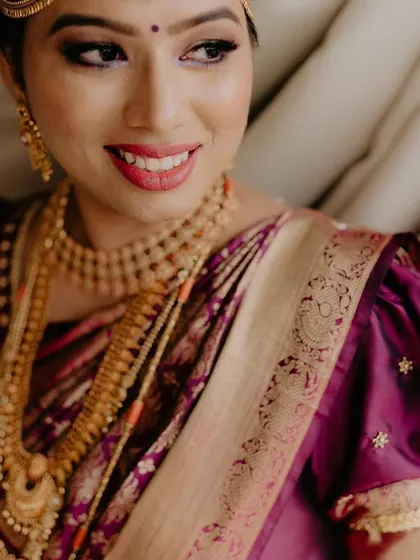 Those eyes and her smile paint a beautiful picture. A close-up of a happy bride, her joy radiating through her flawless makeup.